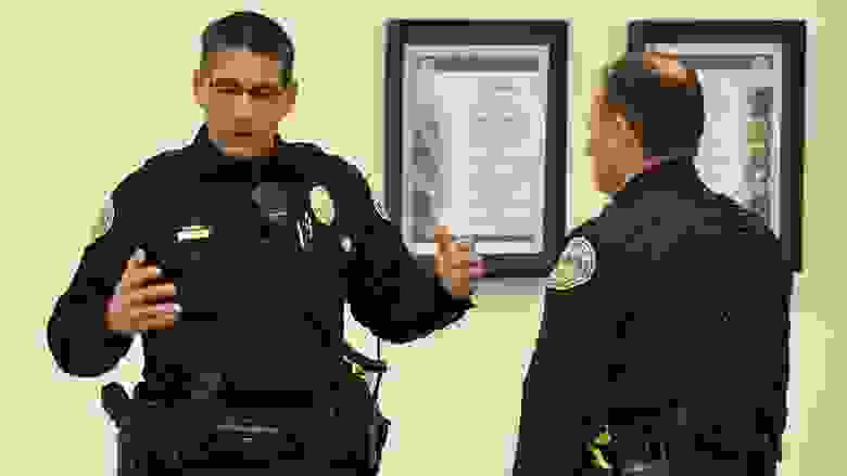 Two police officers discussing the importance of LEOSA benefits.