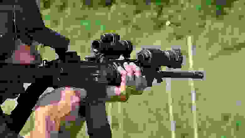 Shooting a sporting rifle on an outdoor range.