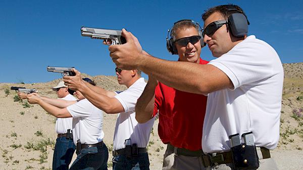 NRA Instructor helping students learn to shoot.
