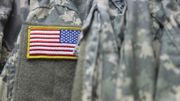 United States flag patch on the shoulder of military fatigues.